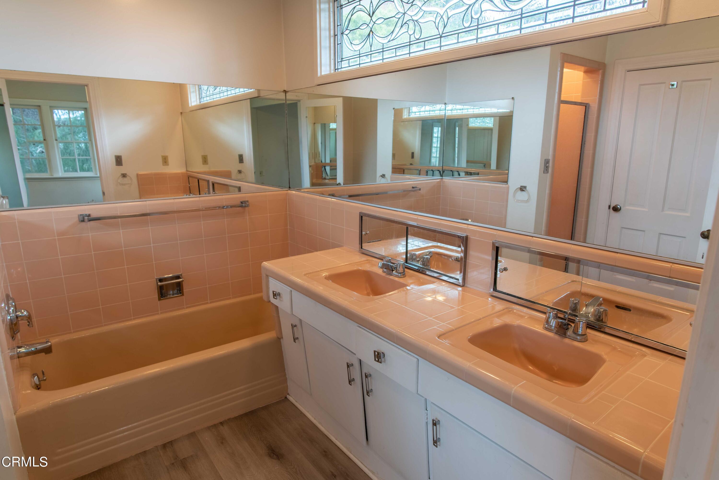 1521 Roca Drive Glendale, CA 91207 - Photo 37 of 54 a bathroom with a tub double vanity sink and mirror