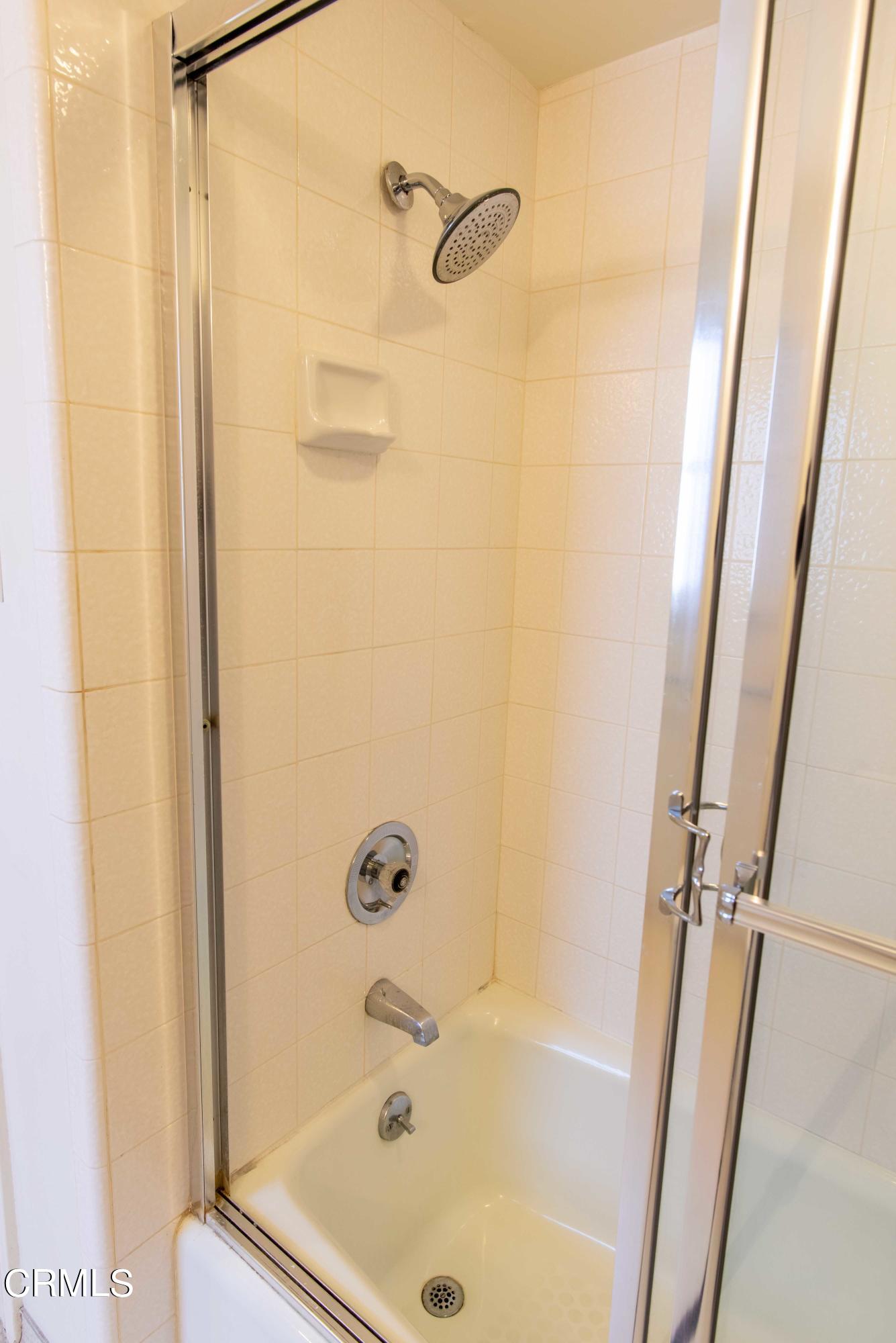 1521 Roca Drive Glendale, CA 91207 - Photo 48 of 54 a bathroom with a tub and a shower