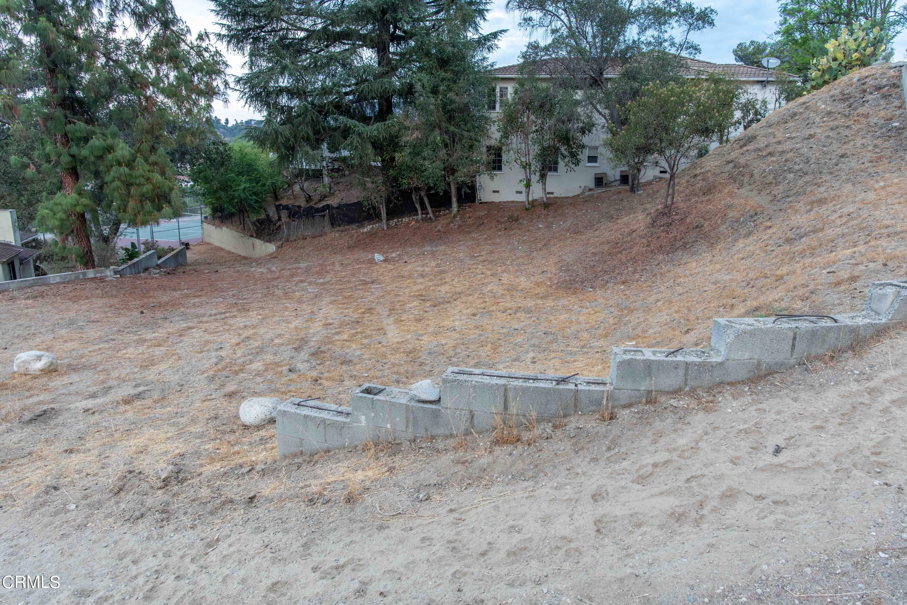 1521 Roca Drive Glendale, CA 91207 - Photo 52 of 54 a view of a dirt road with trees in the background