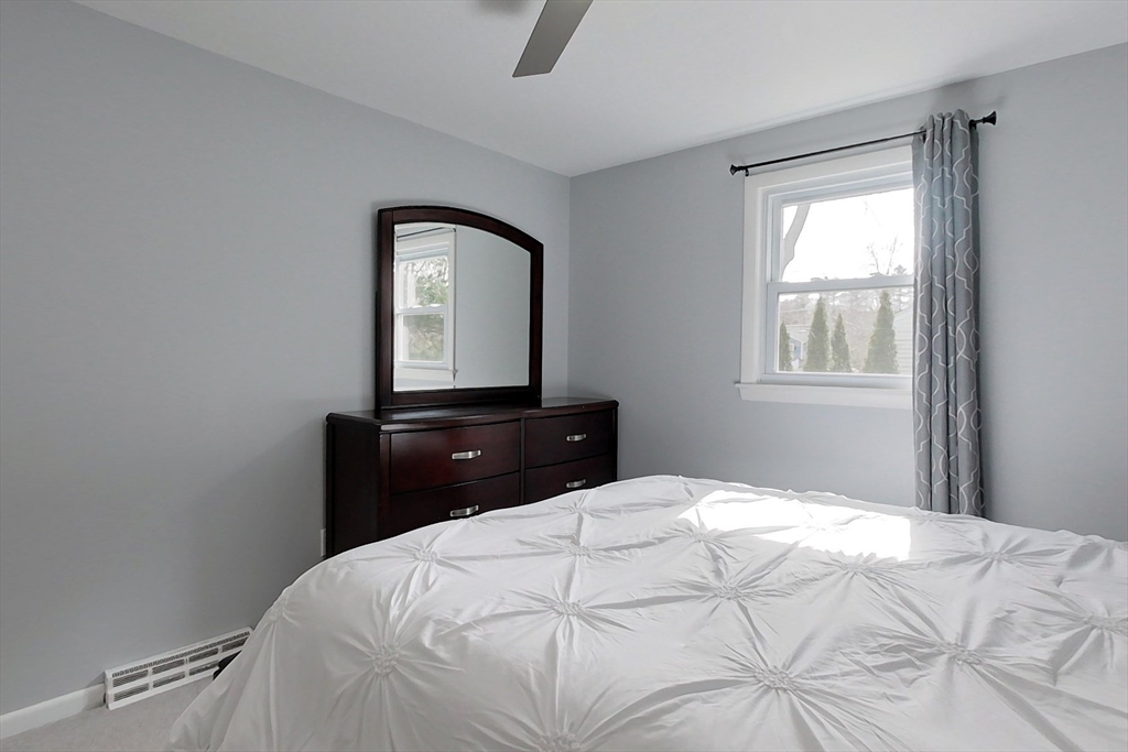30 Haskell Road Pepperell, MA 01463 - Photo 13 of 30 a bedroom with a bed and a mirror