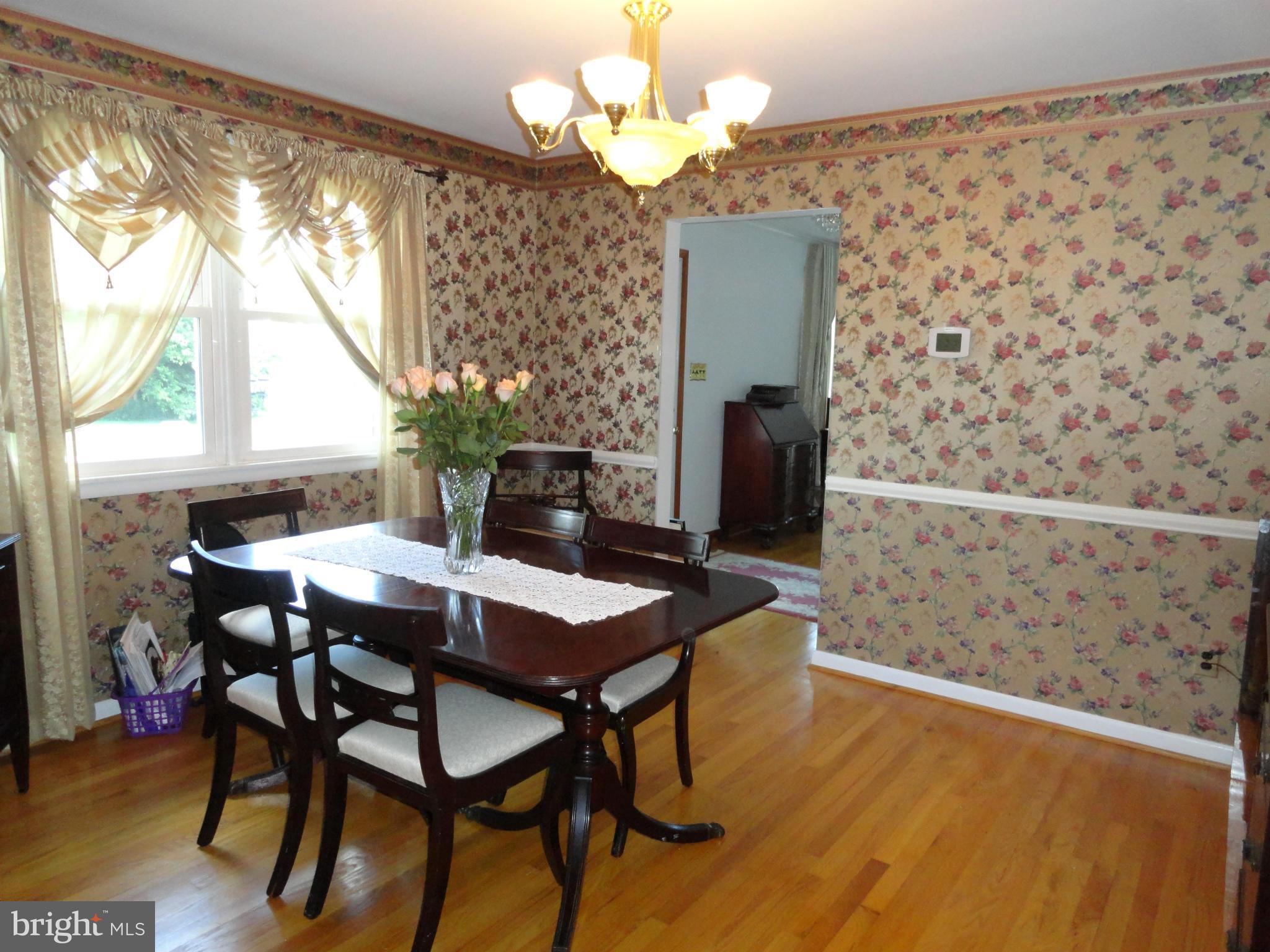 4317 Camellia Road Baltimore, MD 21236 - Photo 3 of 19 a view of a dining room with furniture and a chandelier