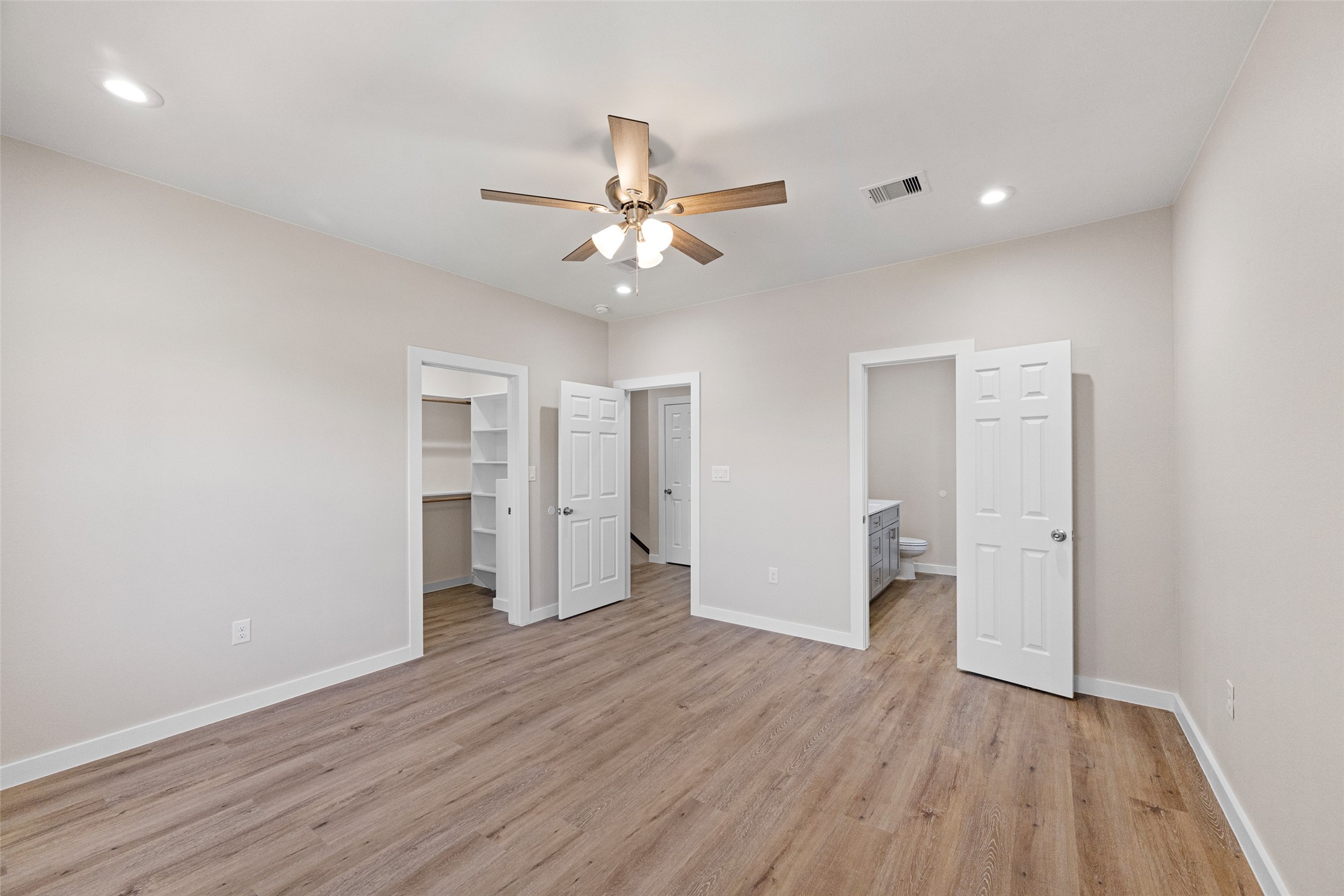 9409 Clinton Drive, Unit A Houston, TX 77029 - Photo 14 of 28 an empty room with wooden floor and ceiling fan