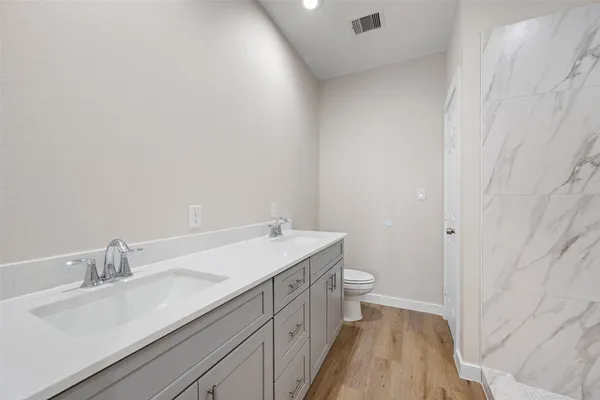 a bathroom with a sink and a toilet