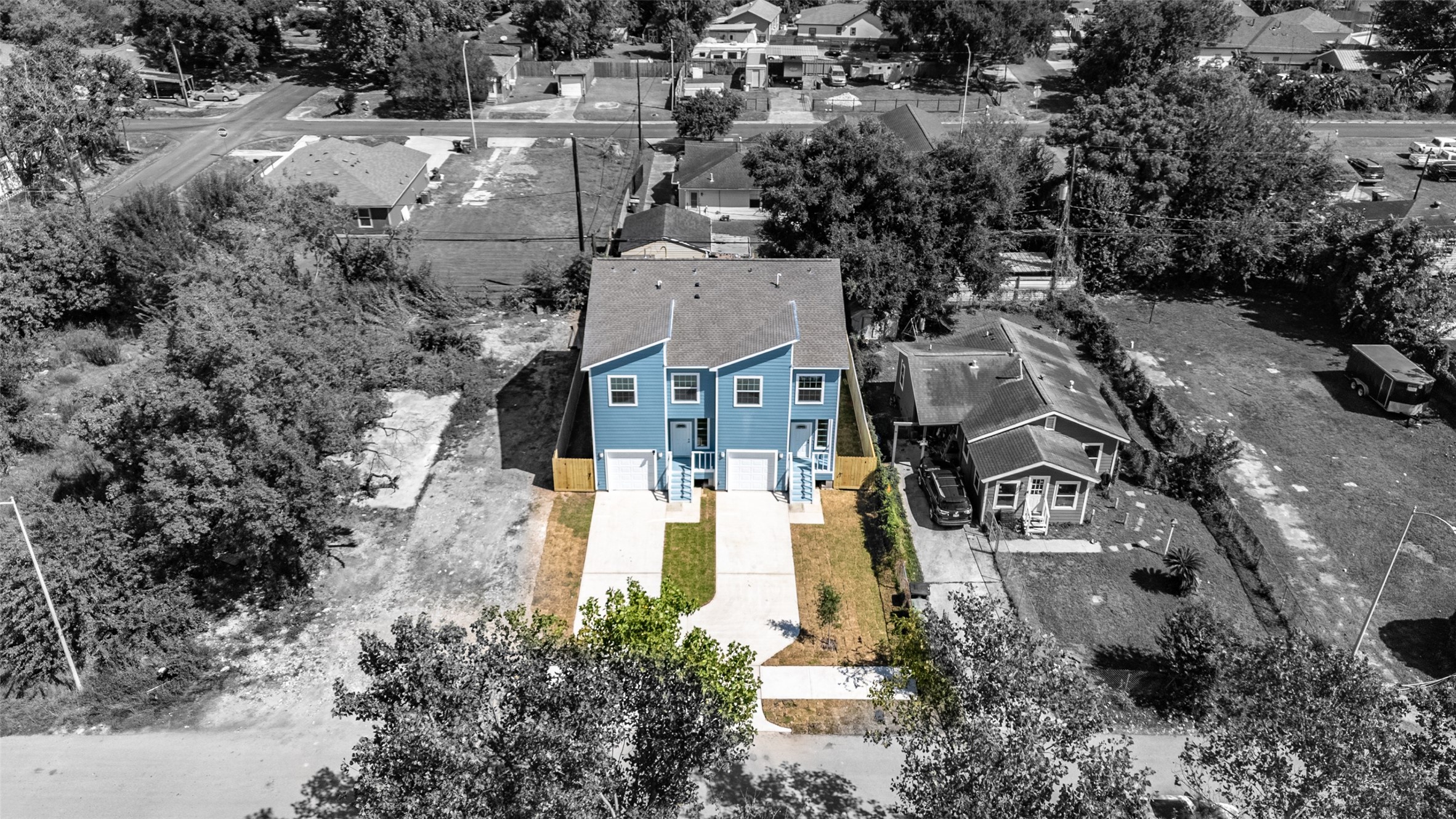 9409 Clinton Drive, Unit A Houston, TX 77029 - Photo 3 of 28 an aerial view of residential houses with outdoor space