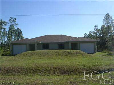 1023 Homestead Road South Lehigh Acres, FL 33974 - Photo 1 of 3 a backyard of a house