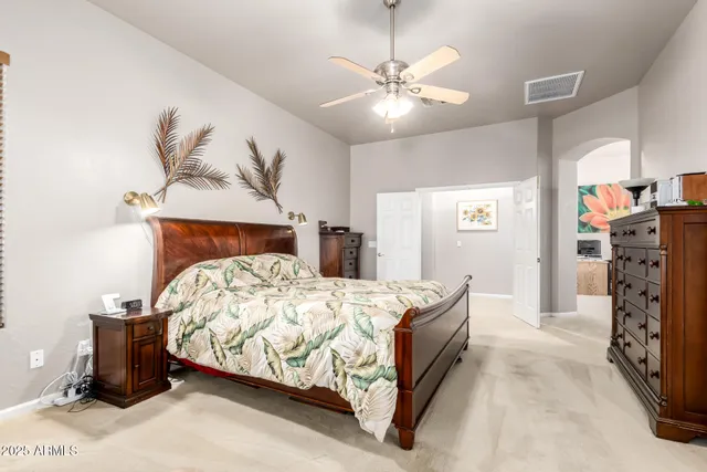 a bedroom with a workspace