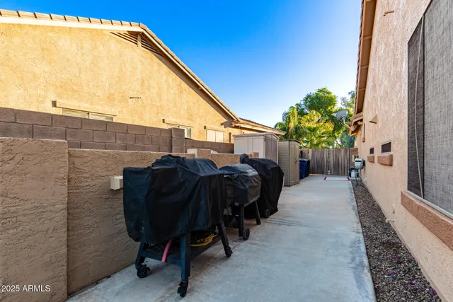 a dining room with furniture a chandelier and window