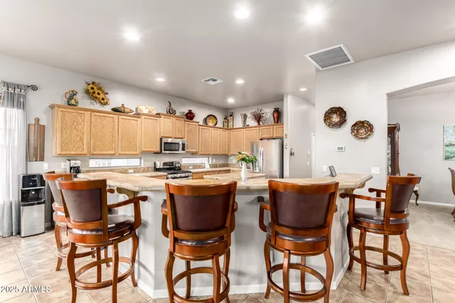 a view of walk in closet with clothes