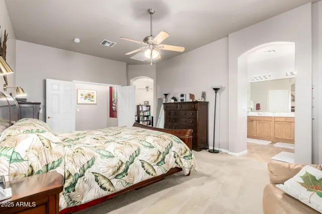 a bathroom with a granite countertop sink a large mirror and shower