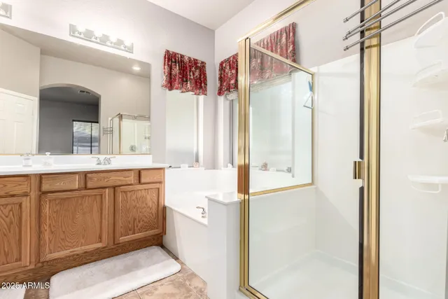 a bathroom with a bathtub and shower