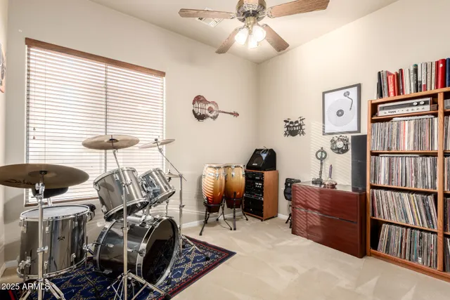a view of a house with swimming pool and sitting area