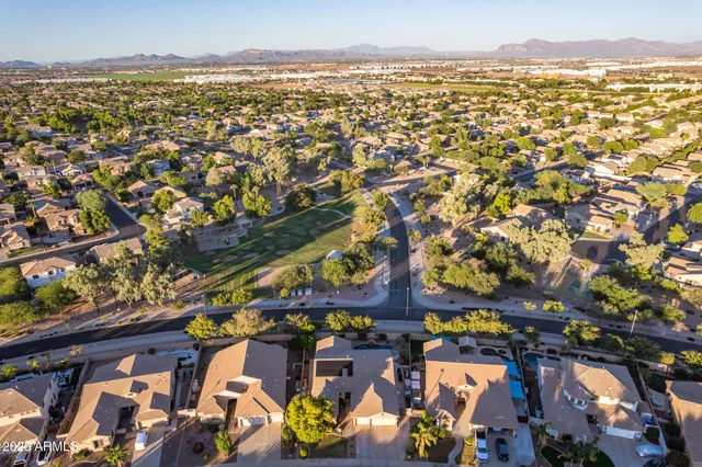 an aerial view of residential building and lake