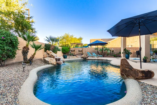 a view of a swimming pool with a patio