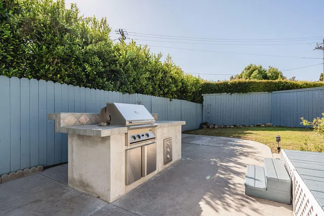 a view of a swimming pool with a yard