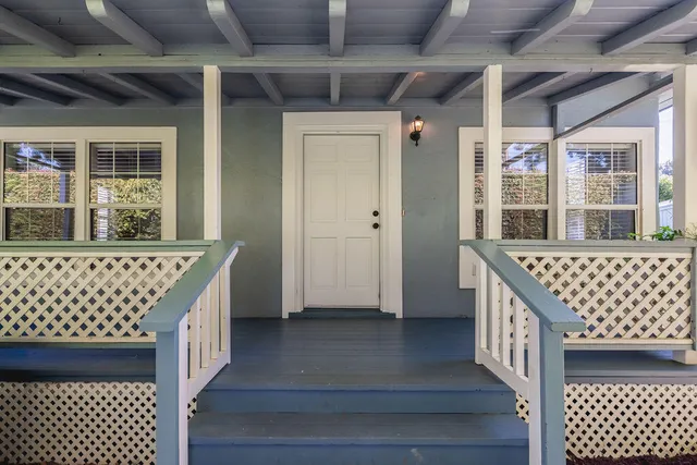 a view of a wooden house with a large window