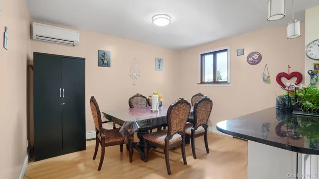 a view of a dining room with furniture and window