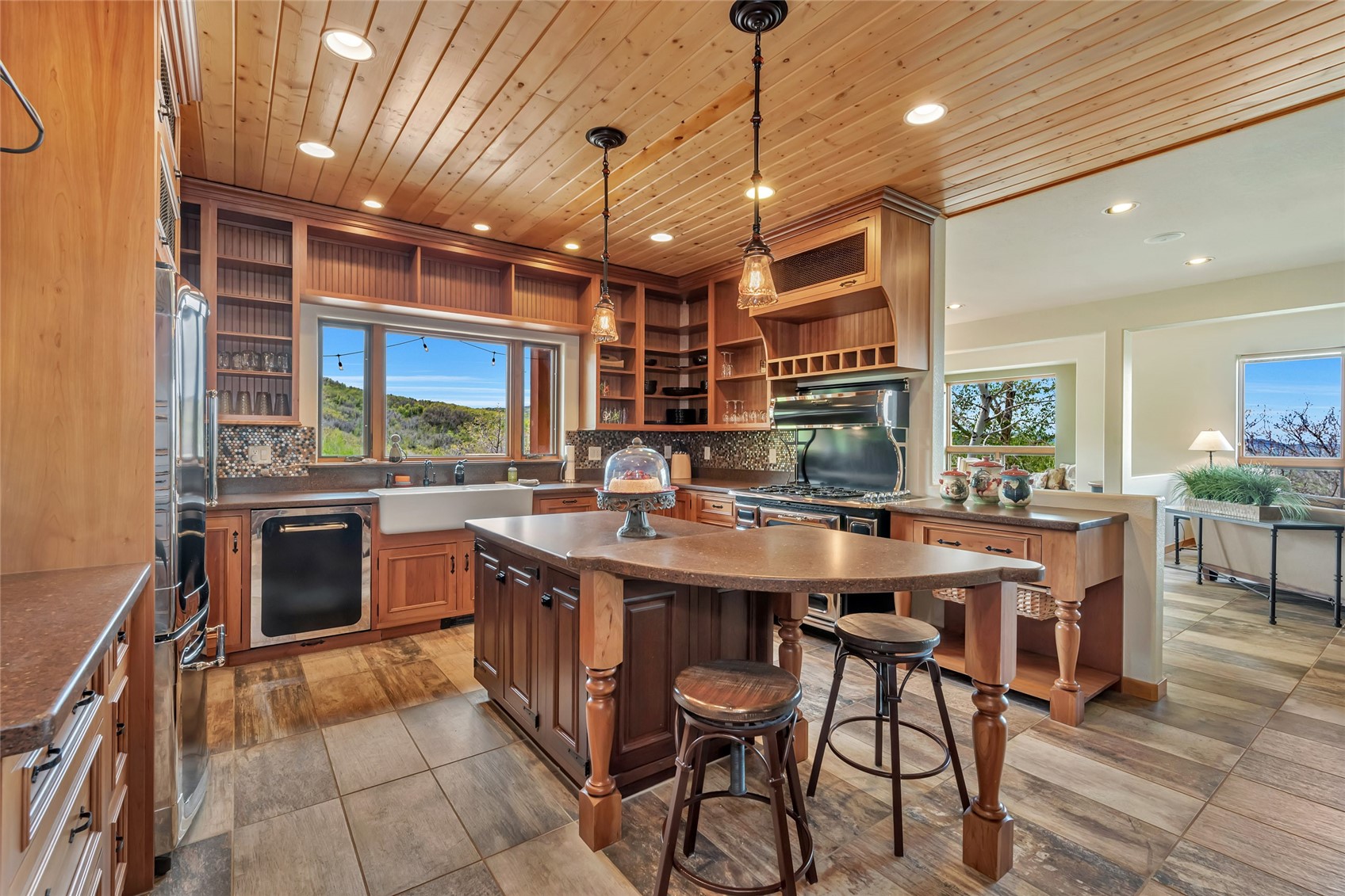 31485 Deerwood Ranch Road Steamboat Springs, CO 80487 - Photo 23 of 49 a kitchen with stainless steel appliances a sink a stove and a refrigerator