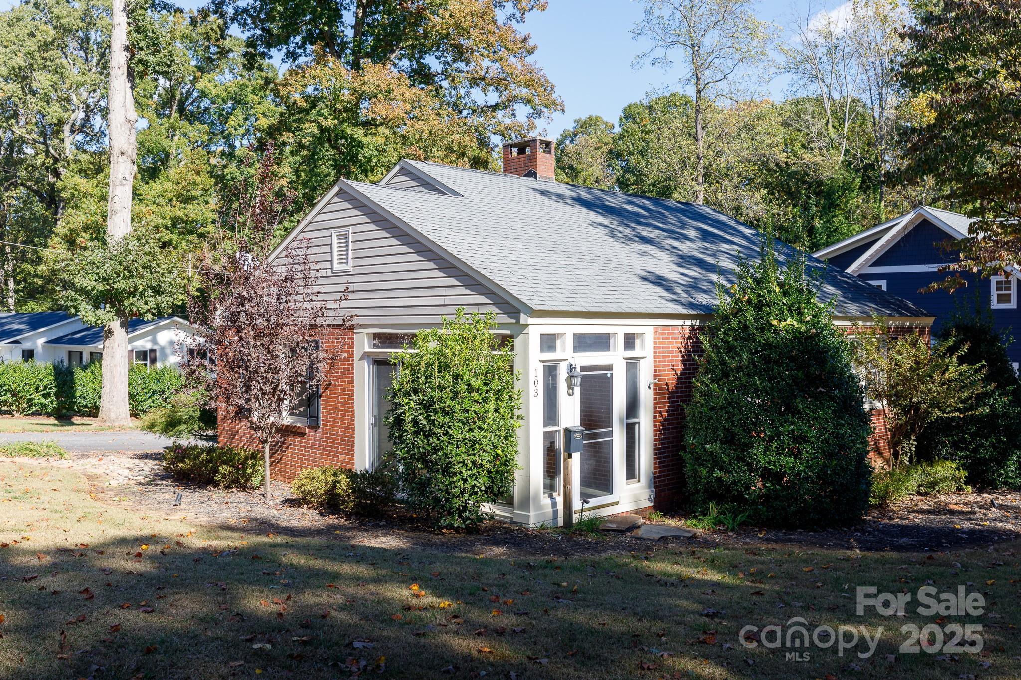 103 East Gregg Street Fort Mill, SC 29715 - Photo 36 of 47 a view of a house with a yard and potted plants