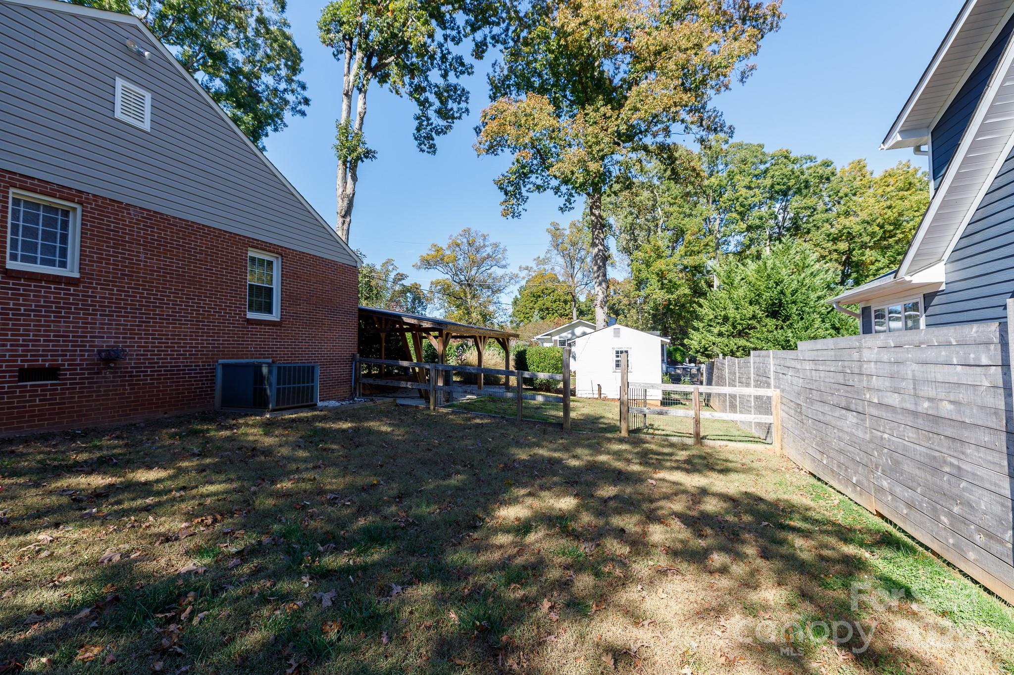 103 East Gregg Street Fort Mill, SC 29715 - Photo 45 of 47 a backyard of a house with table and chairs