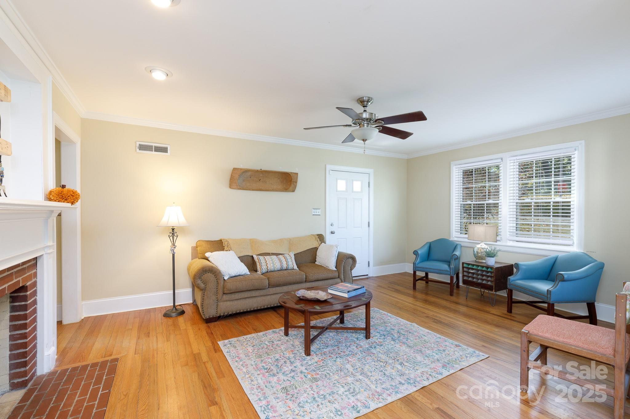 103 East Gregg Street Fort Mill, SC 29715 - Photo 6 of 47 a living room with furniture and a fireplace