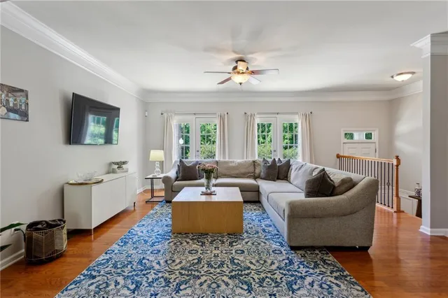 a living room with furniture and a rug