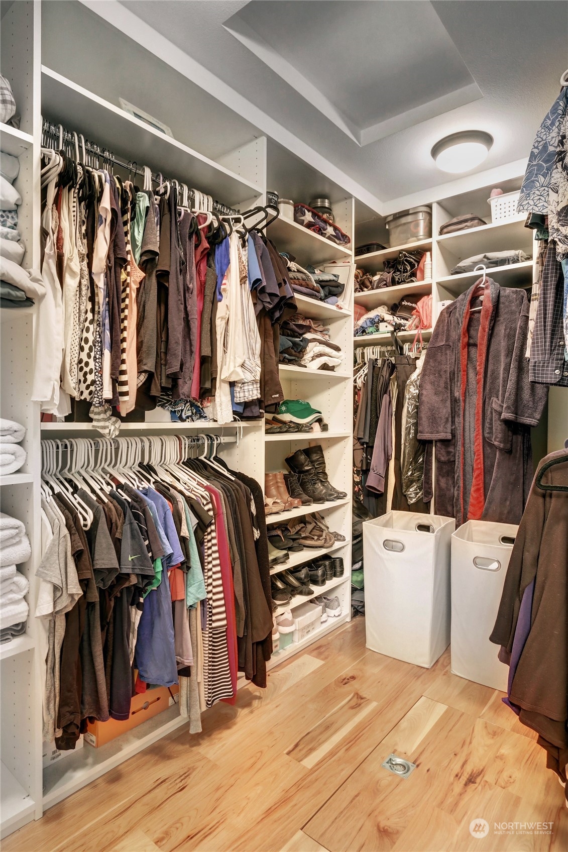 120 219th Place Southwest Bothell, WA 98021 - Photo 11 of 20 a view of walk in closet with clothes and shoes