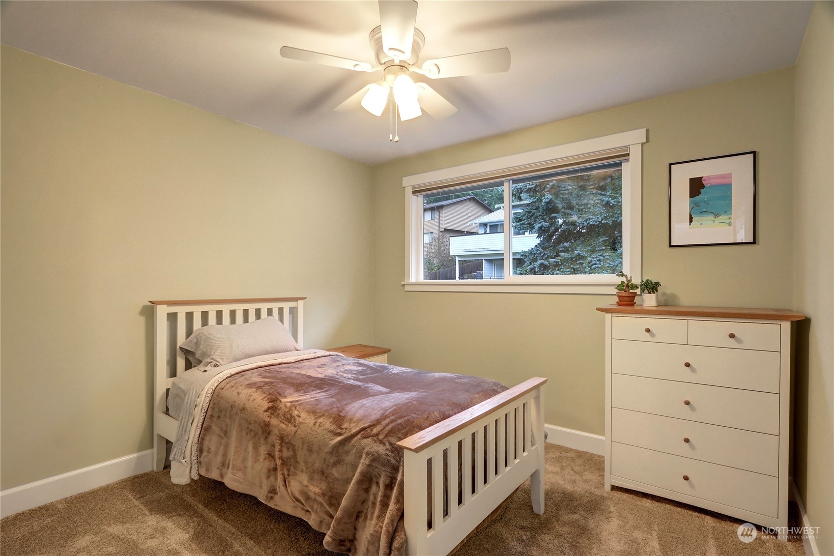 120 219th Place Southwest Bothell, WA 98021 - Photo 14 of 20 a bedroom with a bed a window and a chandelier
