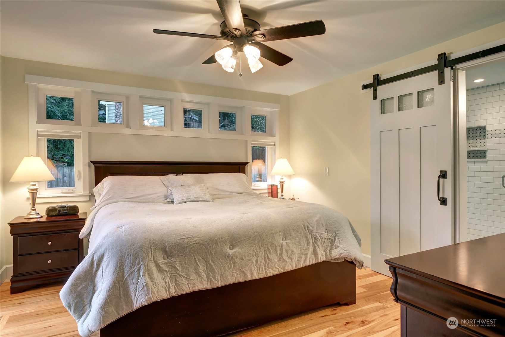 120 219th Place Southwest Bothell, WA 98021 - Photo 7 of 20 a bedroom with a bed and a chandelier