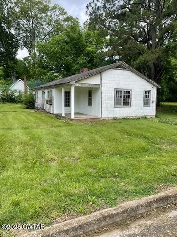 a house view with a garden space