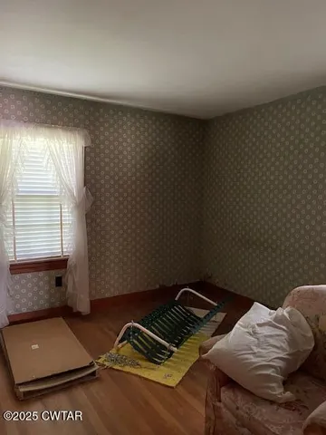 a view of workspace with furniture and window