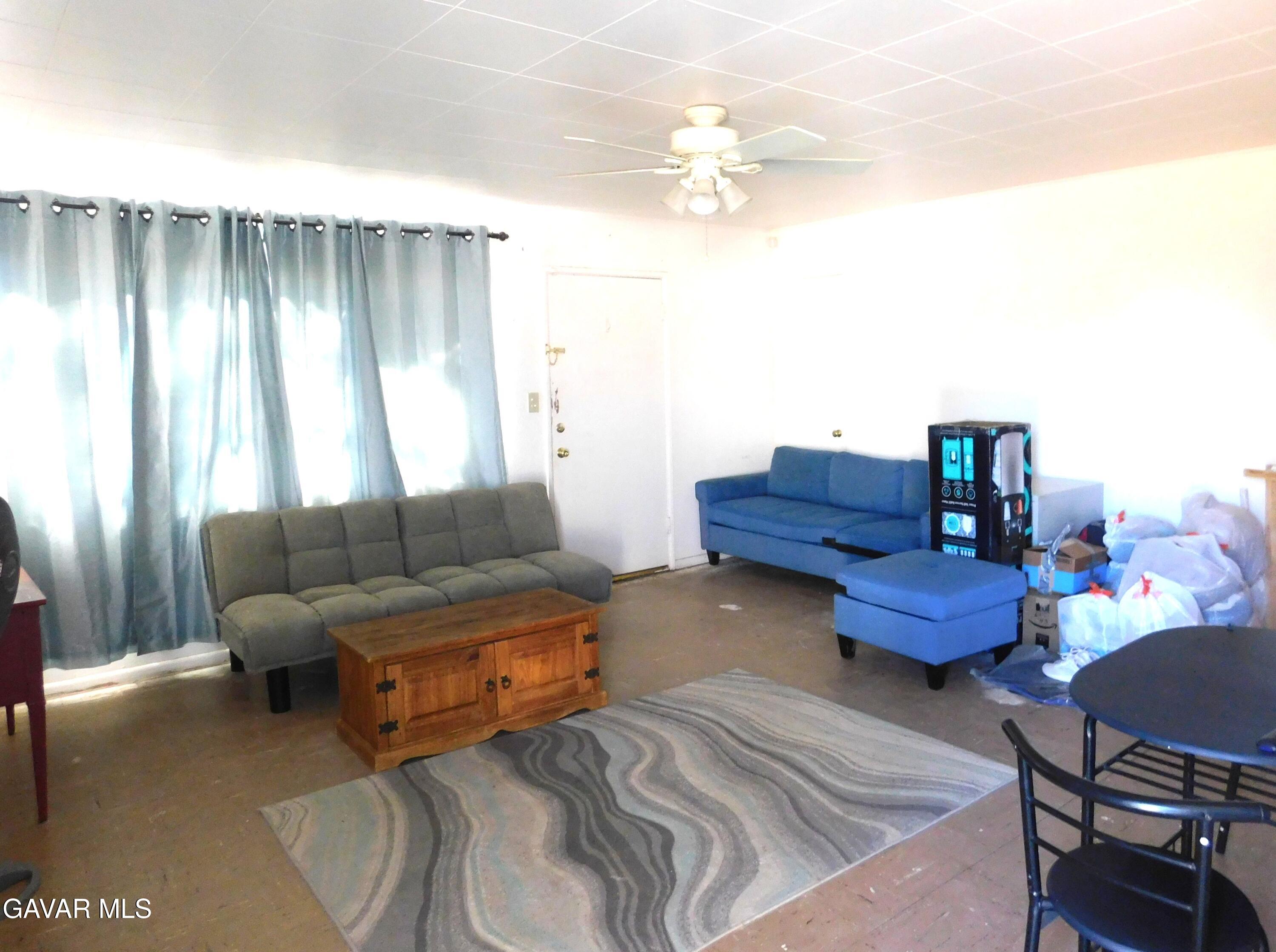 26933 John Street Boron, CA 93516 - Photo 13 of 26 a living room with furniture and a large window