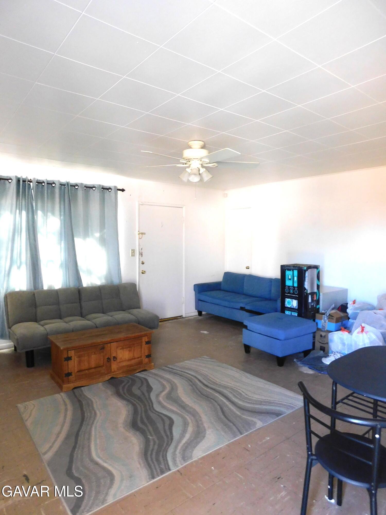 26933 John Street Boron, CA 93516 - Photo 14 of 26 a living room with furniture and a large window