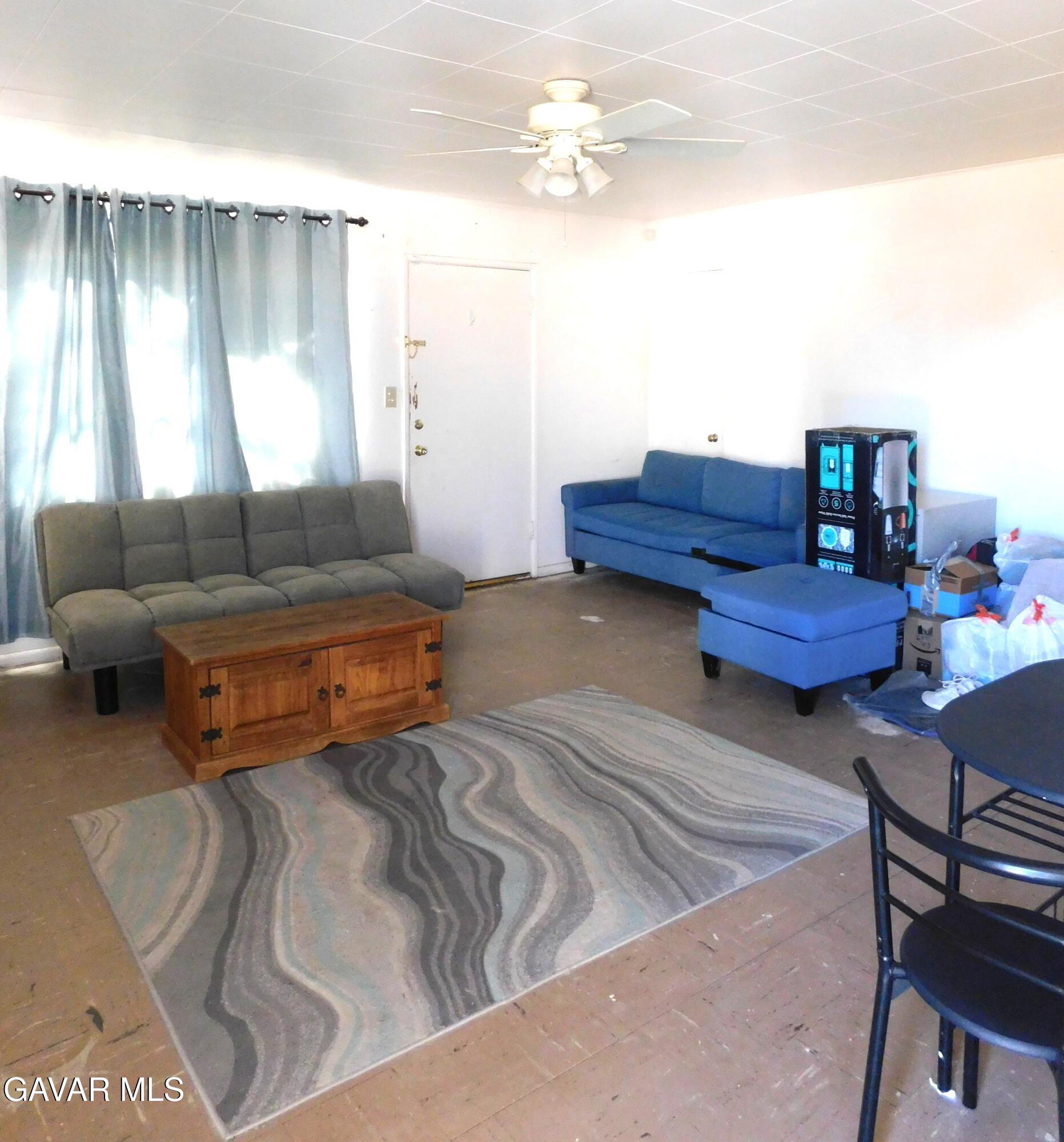 26933 John Street Boron, CA 93516 - Photo 15 of 26 a living room with furniture and a window