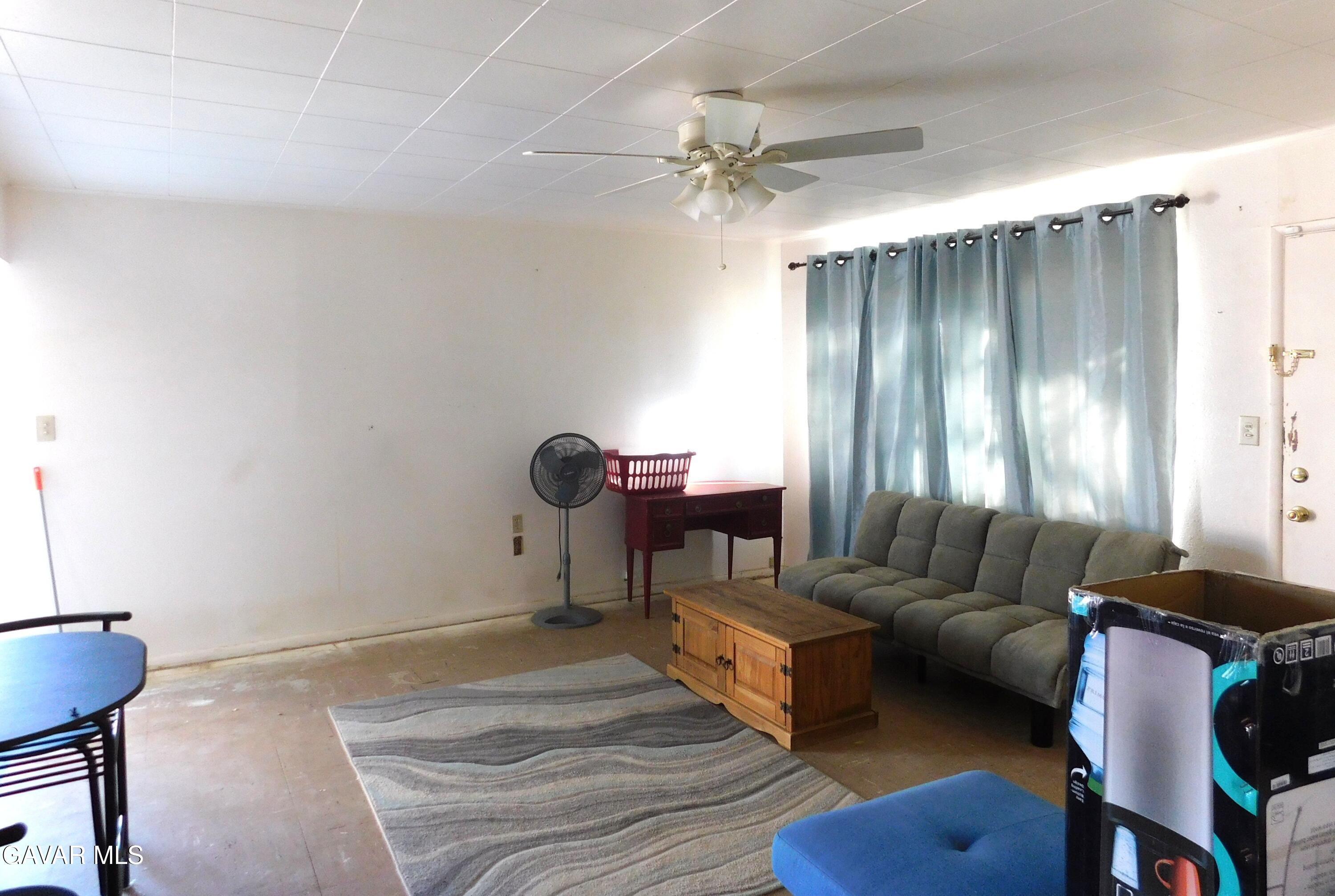 26933 John Street Boron, CA 93516 - Photo 16 of 26 a living room with furniture and a window