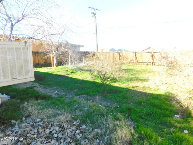 a view of a yard with an ocean beach
