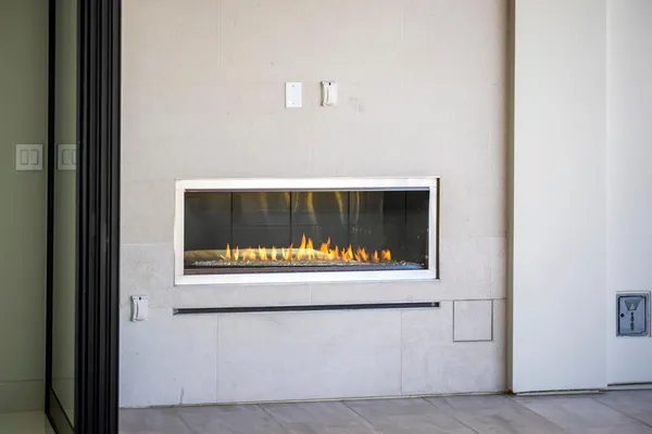 a kitchen with stainless steel appliances granite countertop a kitchen island a stove a table and a sink