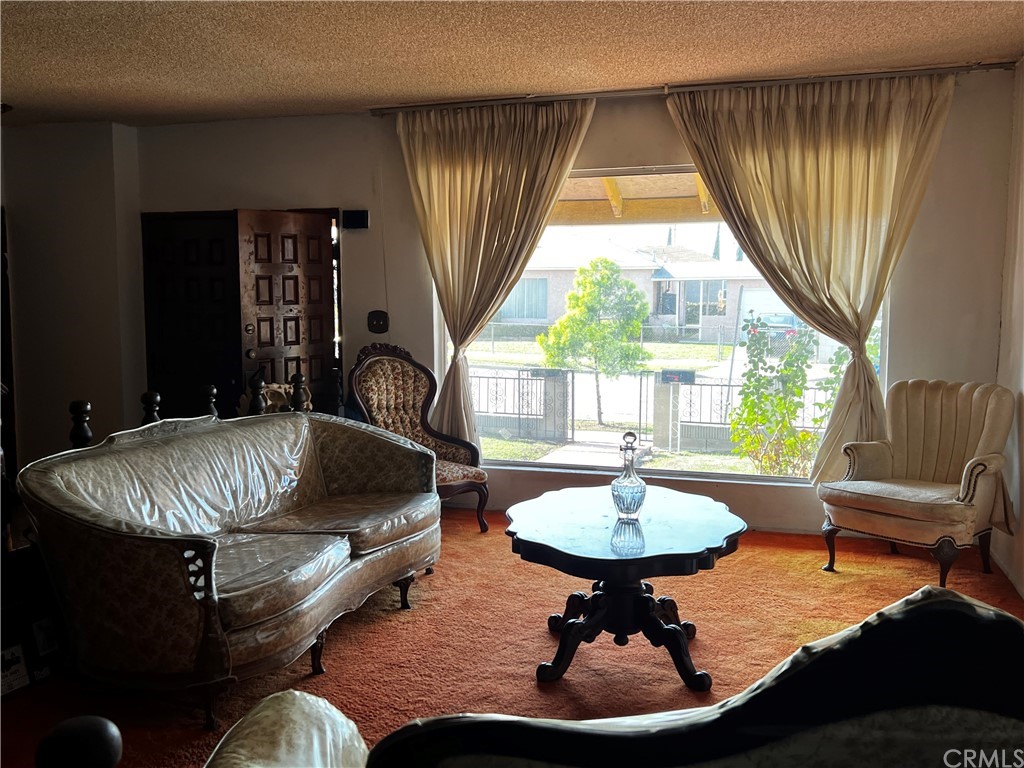 1506 South Grandee Avenue Compton, CA 90220 - Photo 7 of 35 a living room with furniture and a window