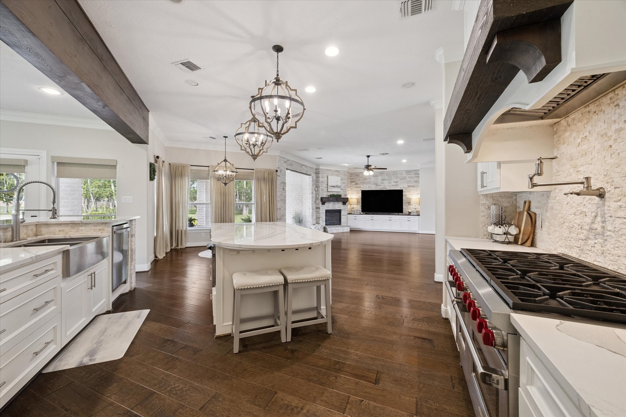 2904 Bridle Path Lane Friendswood, TX 77546 - Photo 17 of 49 The kitchen opens to both the den and the family room, creating a seamless flow and offering plenty of space for relaxing and entertaining.