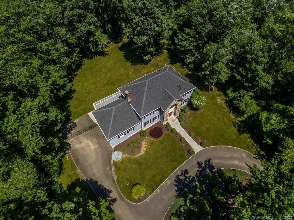 76 Silver Hill Road Easton, CT 06612 - Photo 1 of 1 an aerial view of a house with a garden and trees