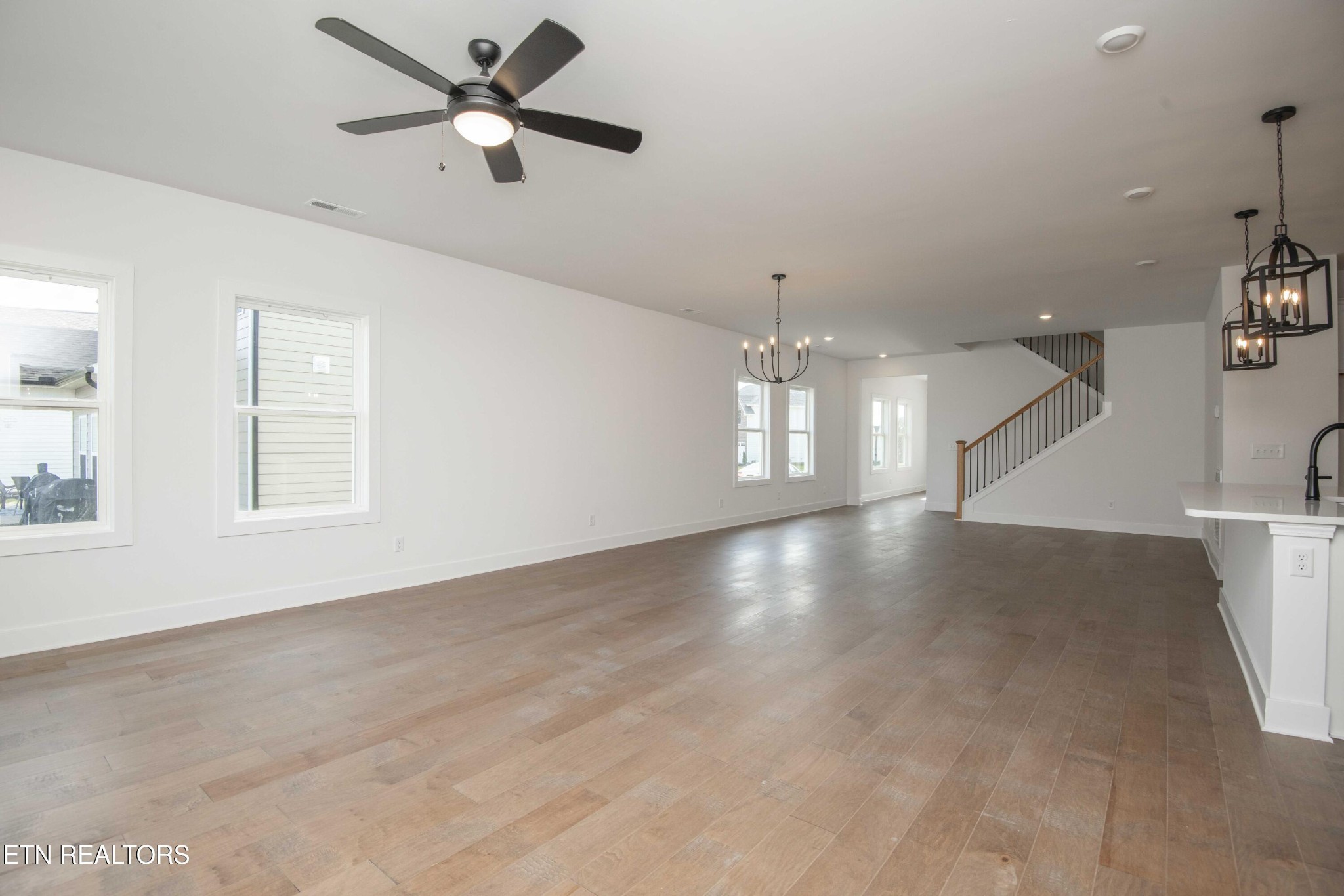 420 Ivey Farms Road Knoxville, TN 37934 - Photo 12 of 56 a view of an empty room with a window and a ceiling fan