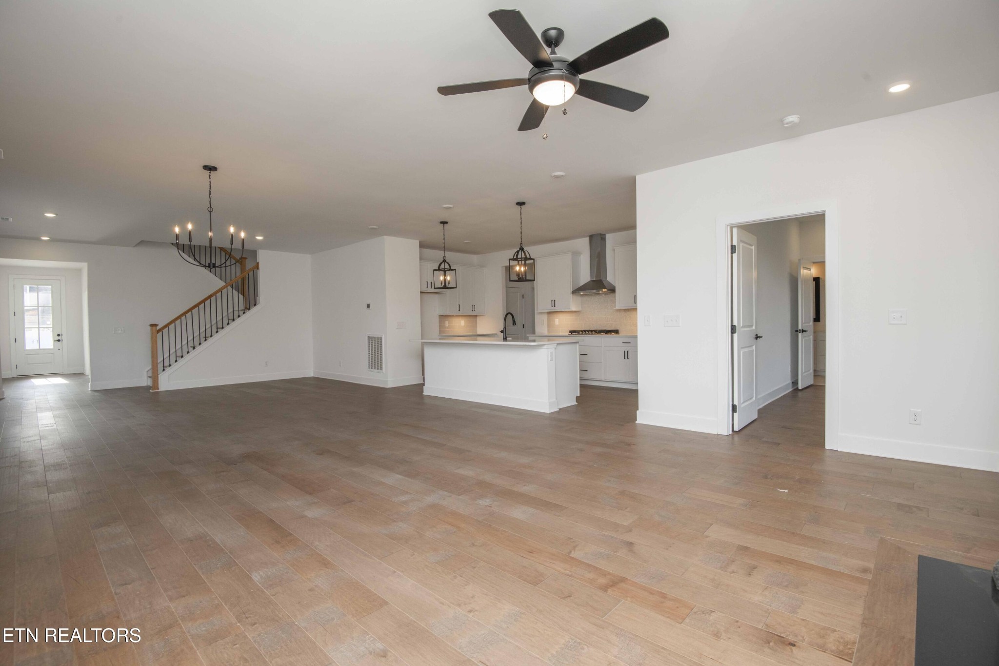 420 Ivey Farms Road Knoxville, TN 37934 - Photo 13 of 56 a view of a living room a ceiling fan and kitchen view