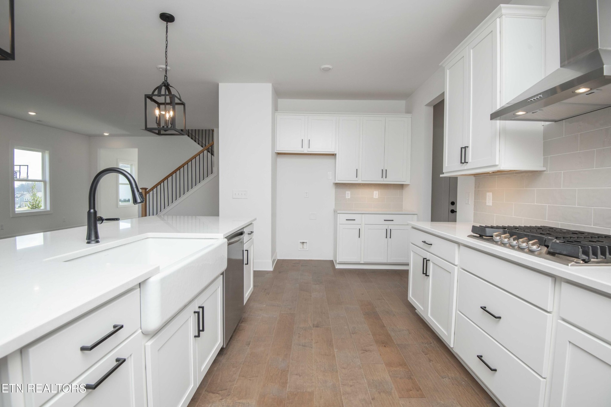 420 Ivey Farms Road Knoxville, TN 37934 - Photo 16 of 56 a kitchen with sink stove and cabinets