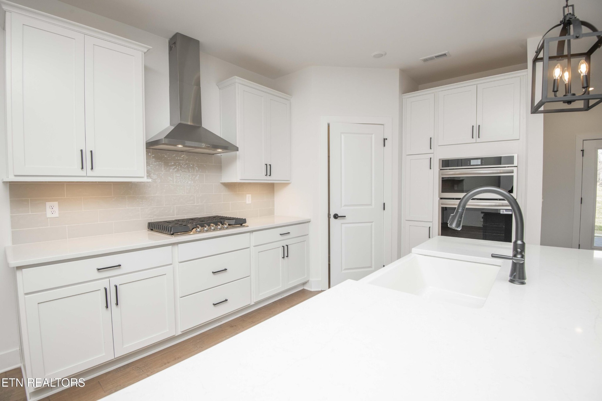 420 Ivey Farms Road Knoxville, TN 37934 - Photo 20 of 56 a kitchen with stainless steel appliances a sink a stove and cabinets