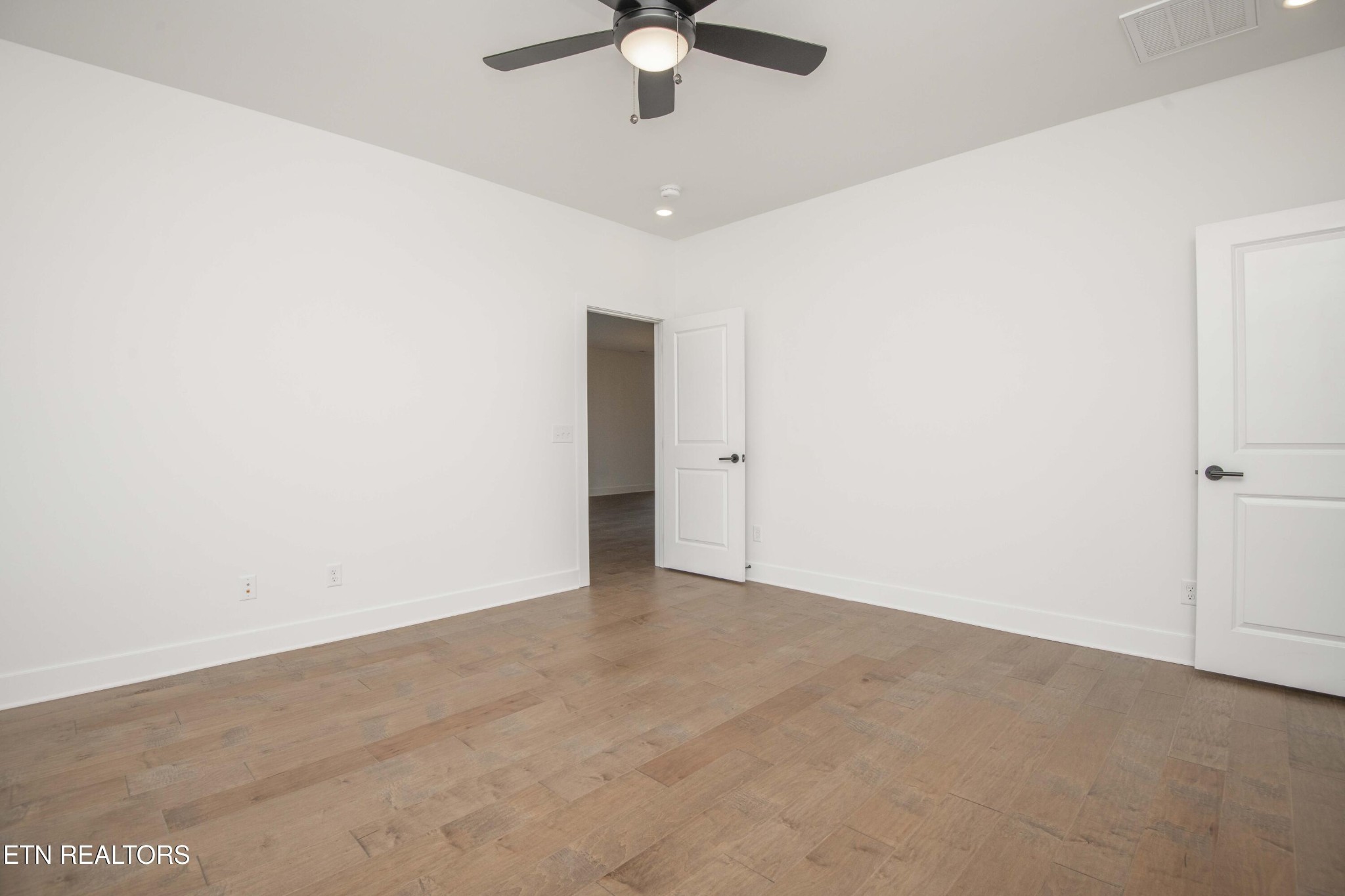 420 Ivey Farms Road Knoxville, TN 37934 - Photo 25 of 56 an empty room with chandelier fan