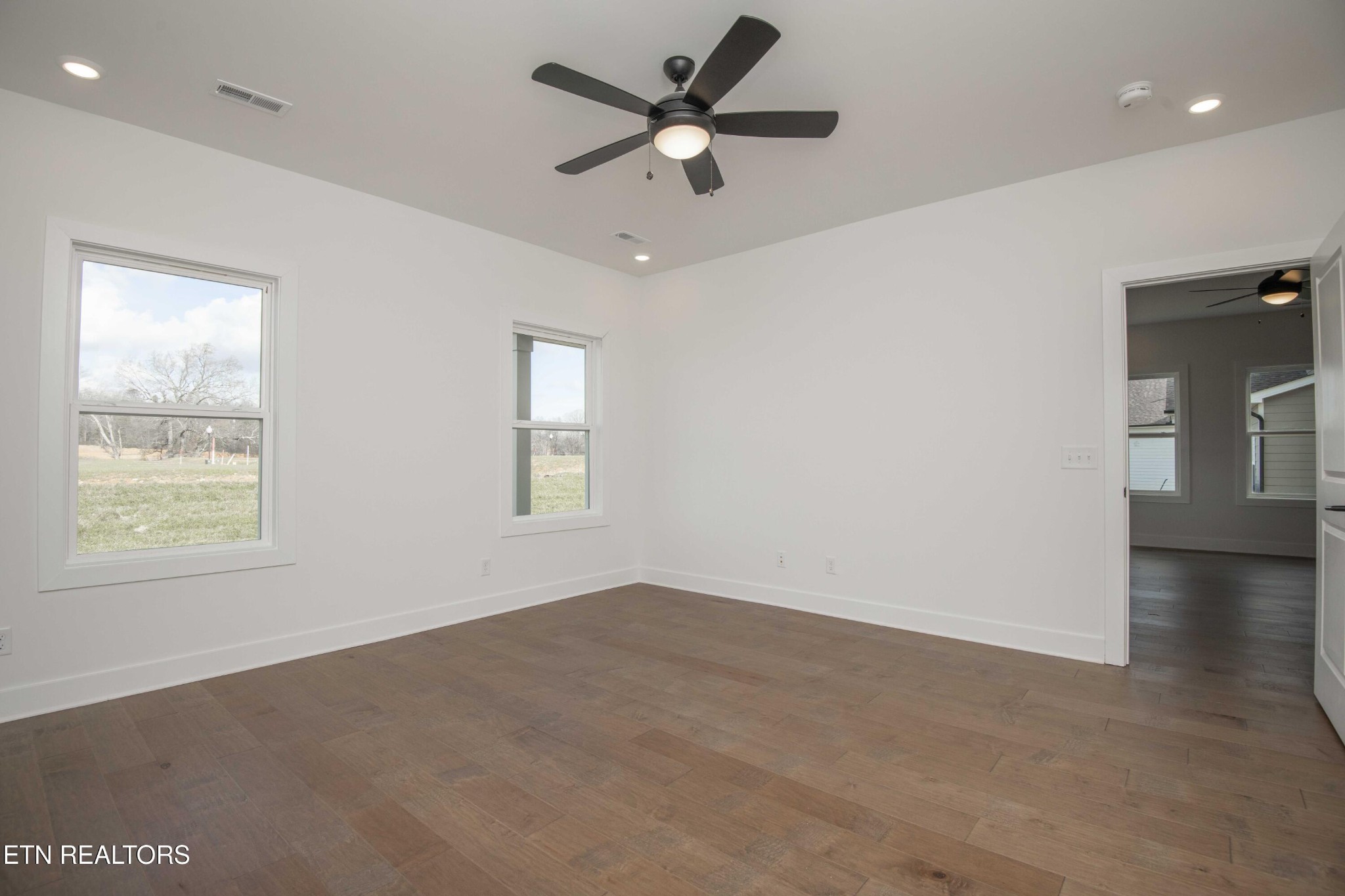 420 Ivey Farms Road Knoxville, TN 37934 - Photo 28 of 56 a view of an empty room with window and wooden floor