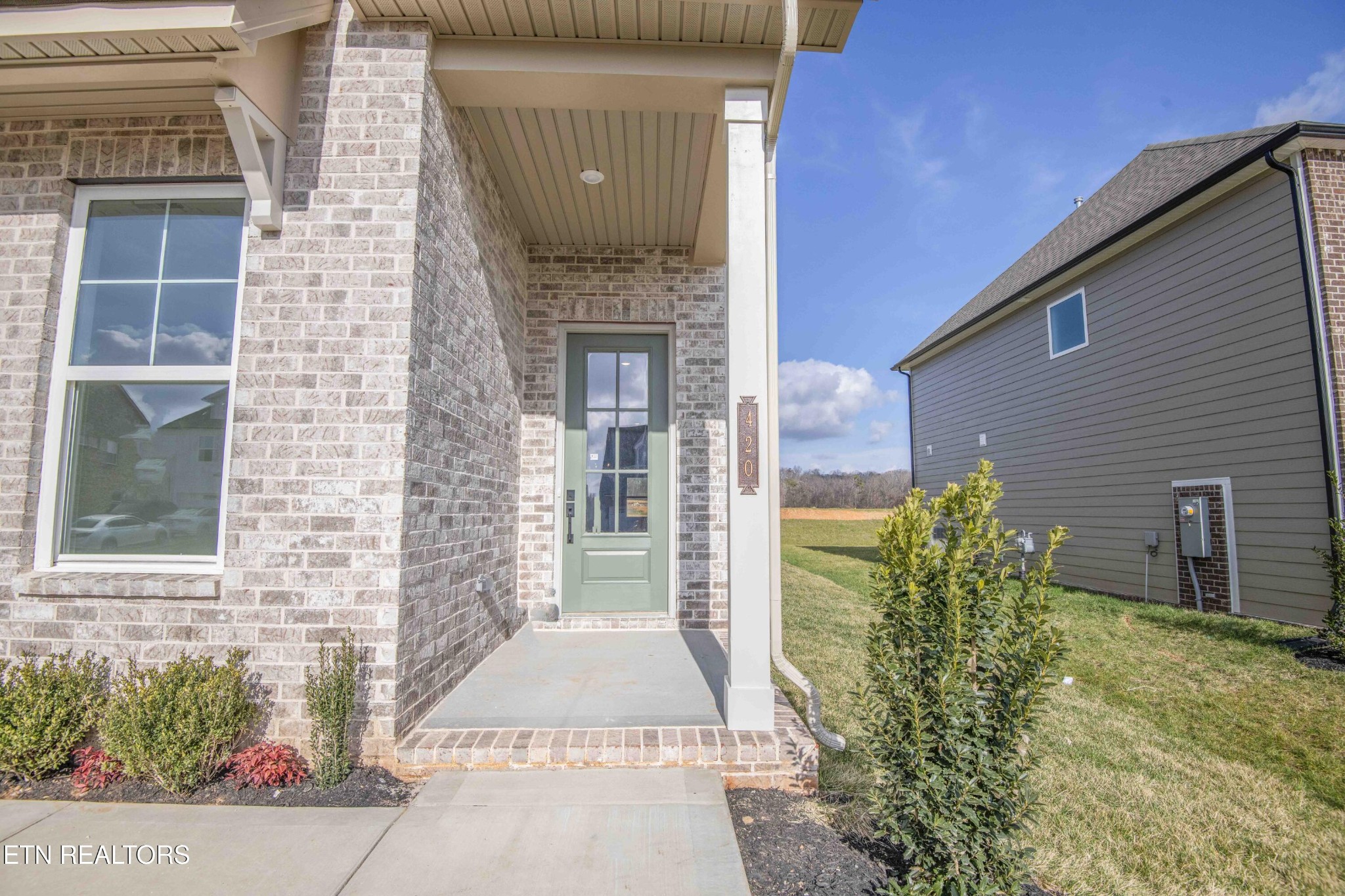 420 Ivey Farms Road Knoxville, TN 37934 - Photo 3 of 56 a front view of a house with a yard