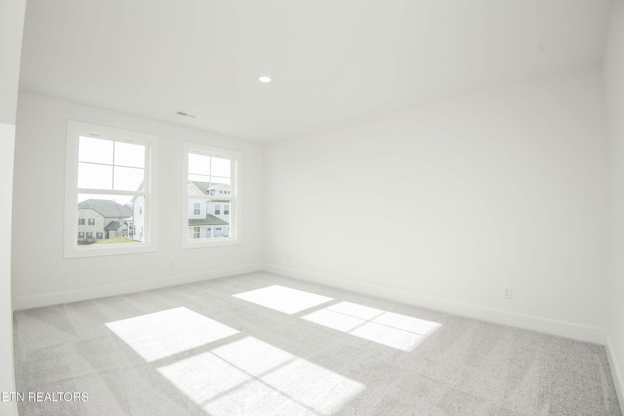 420 Ivey Farms Road Knoxville, TN 37934 - Photo 33 of 56 an empty room with windows