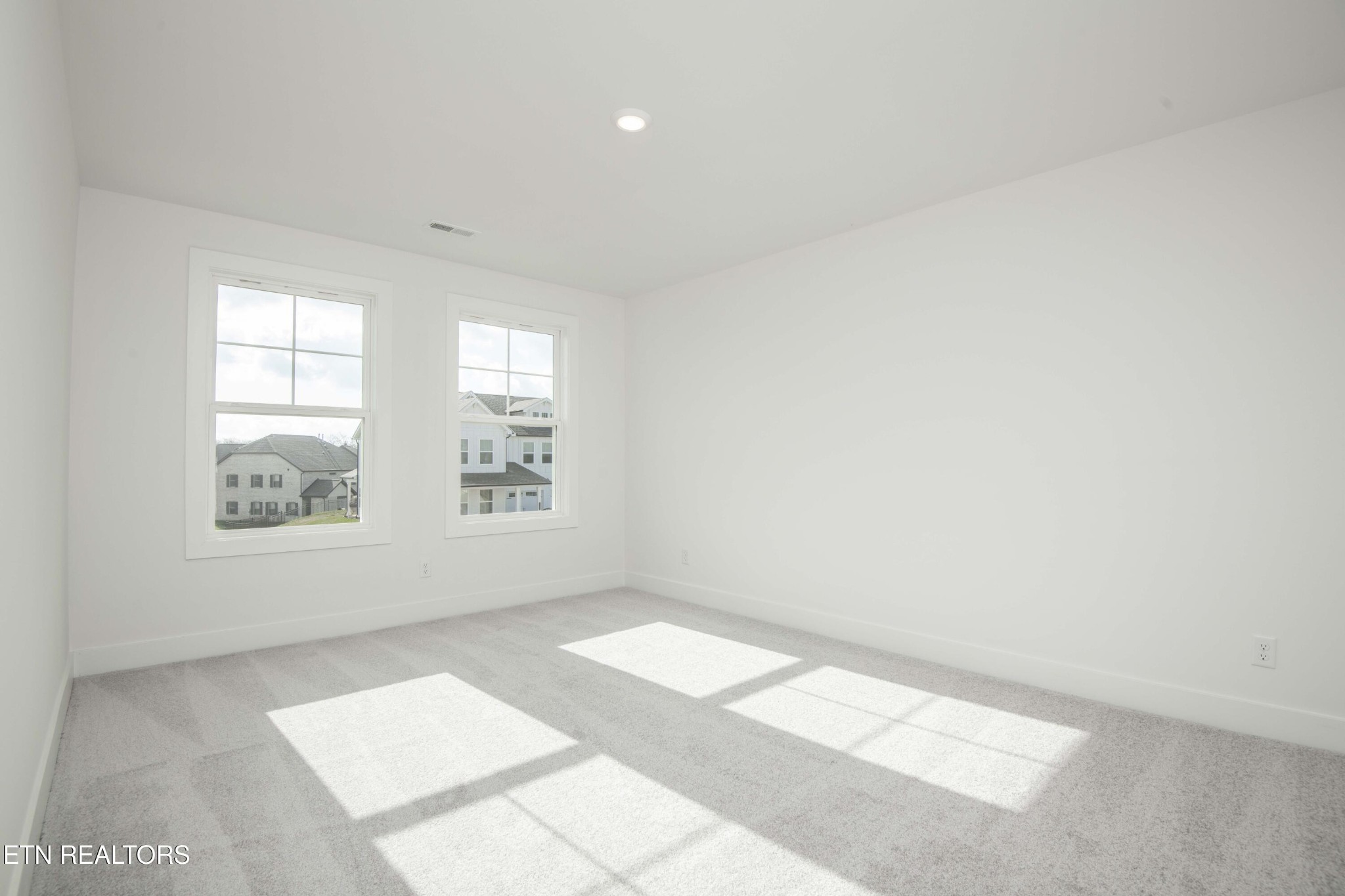 420 Ivey Farms Road Knoxville, TN 37934 - Photo 34 of 56 an empty room with windows
