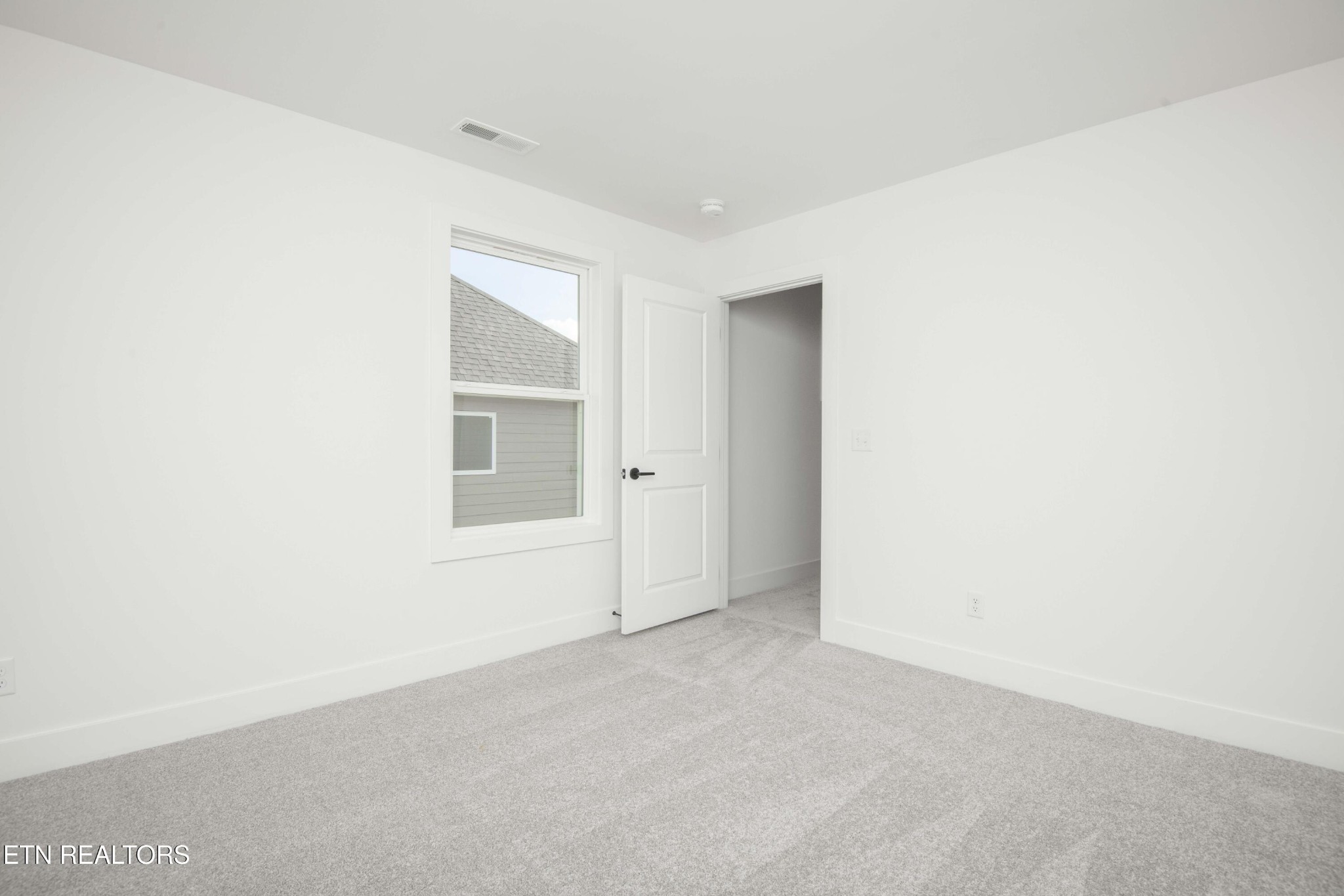 420 Ivey Farms Road Knoxville, TN 37934 - Photo 40 of 56 a view of an empty room with a window