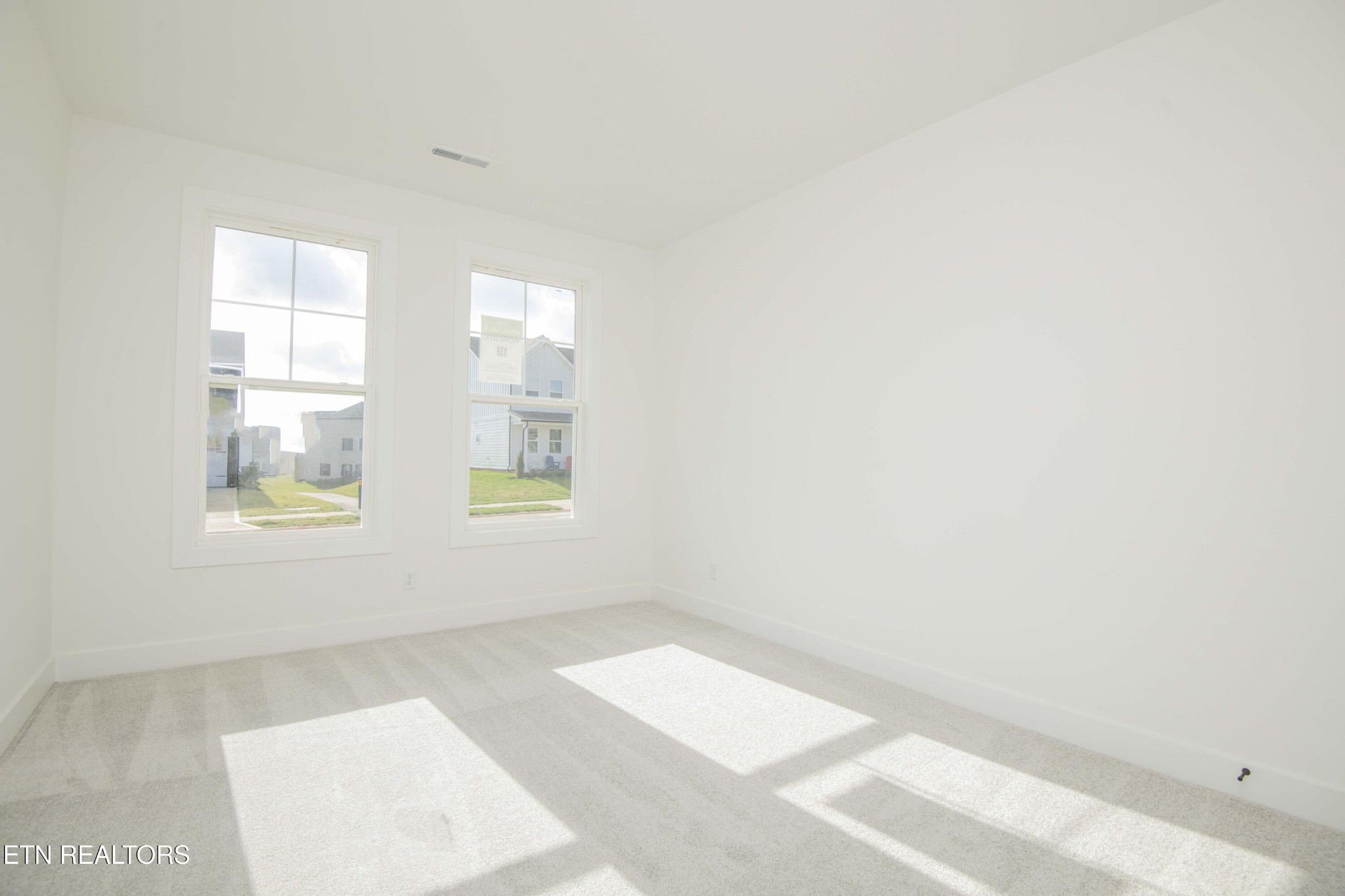 420 Ivey Farms Road Knoxville, TN 37934 - Photo 4 of 56 a view of an empty room with a window